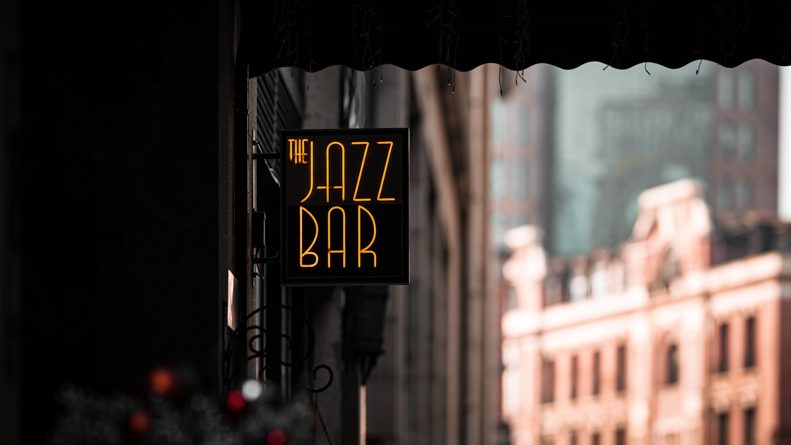 Vintage jazz club sign mounted on the side of a building